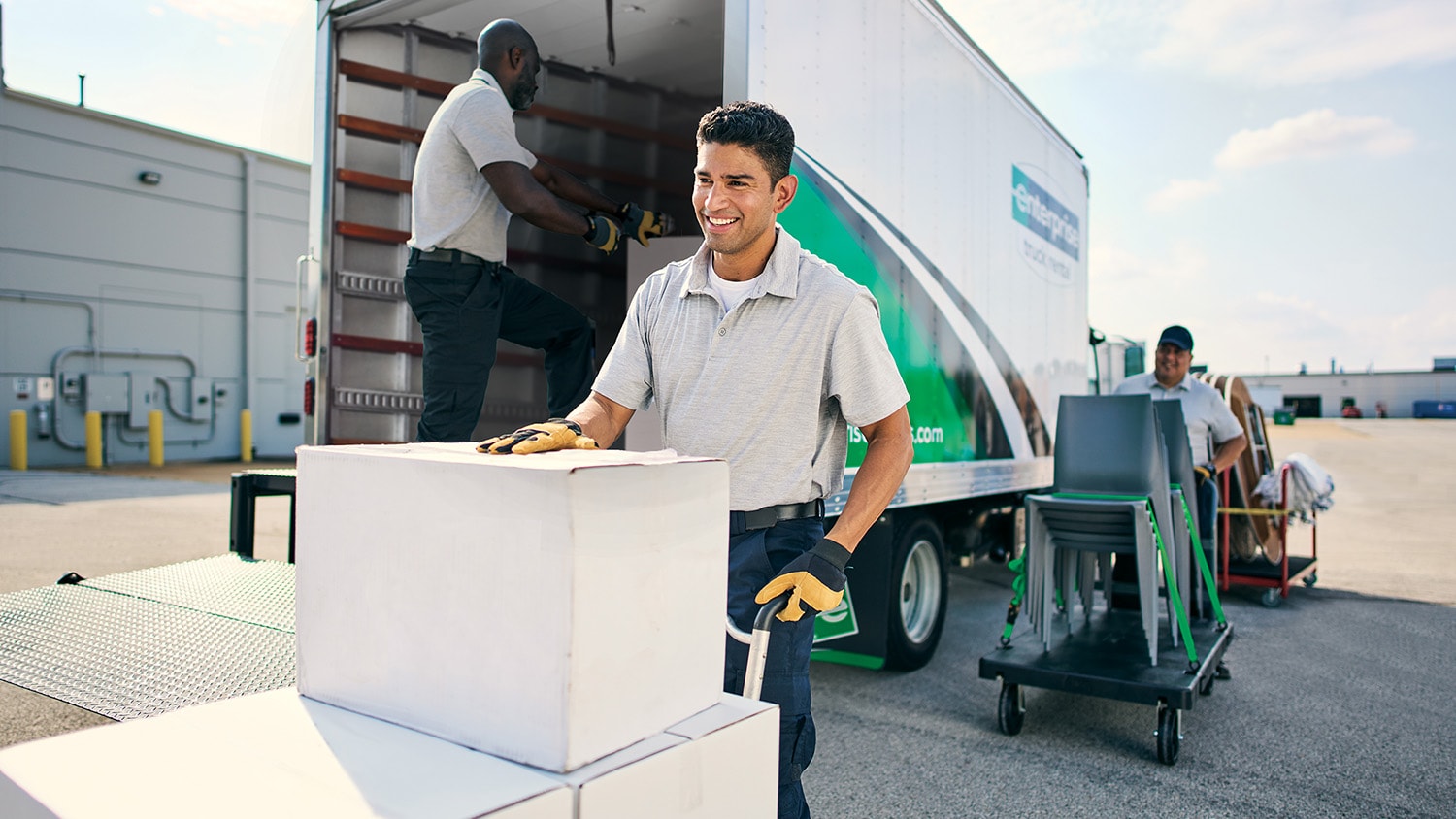 Employees loading an Enterprise Rental Truck